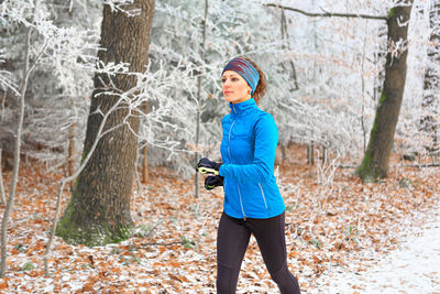 Full length of woman on snow covered land