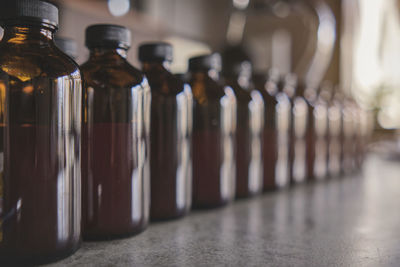 Close-up of glass bottles on table