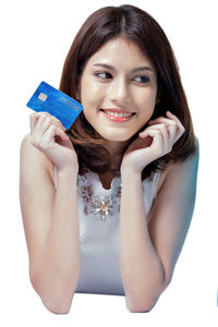 Portrait of a smiling young woman over white background