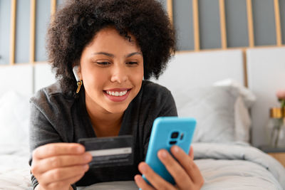 Young woman using phone