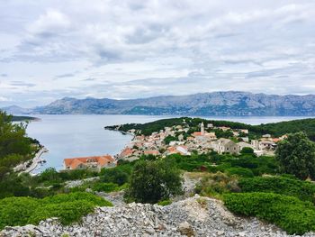 Scenic view of sea and buildings against sky