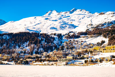 The town and lake of santk moritz in winter. engadin, switzerland.