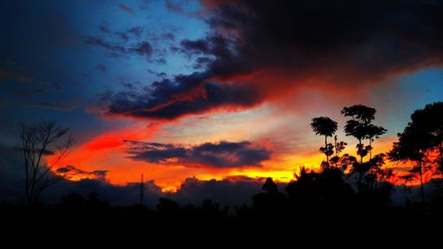 Scenic view of dramatic sky at sunset