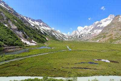 Scenic view of snowcapped mountains against sky