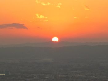 Scenic view of silhouette landscape against romantic sky at sunset