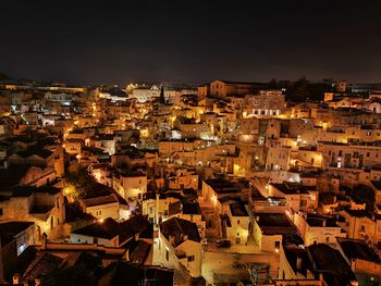 High angle shot of illuminated townscape against sky