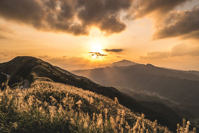 Scenic view of mountains against sky during sunset