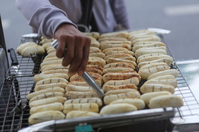 Grilled bananas are sold and prepared on the streets
