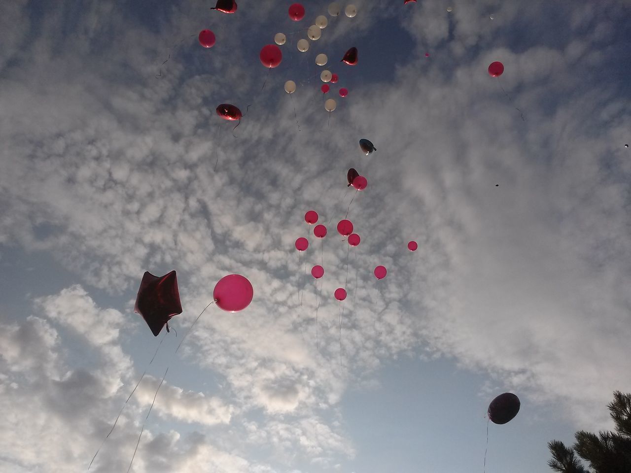 low angle view, mid-air, sky, flying, balloon, cloud - sky, hot air balloon, multi colored, celebration, cloud, cloudy, parachute, red, outdoors, nature, blue, no people, adventure, day, colorful