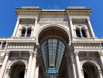 Low angle view of historical building against blue sky