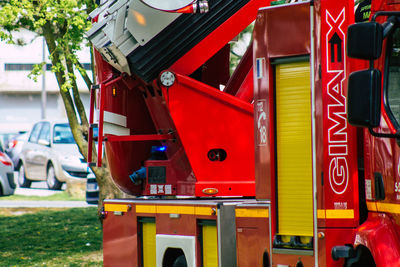 Close-up of red shopping cart in city