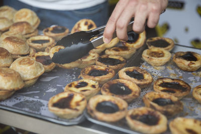 Close-up of man preparing food on table