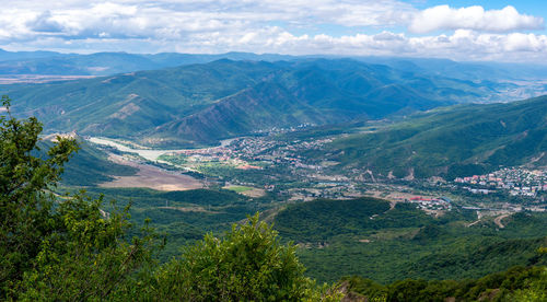 Aerial view of landscape and mountains against sky