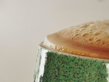 Close-up of coffee cup against white background