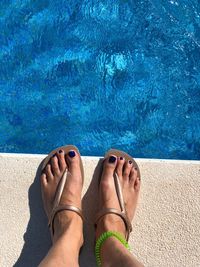 Low section of woman at poolside