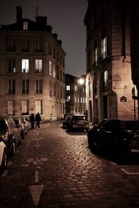 Cars on street in city at night