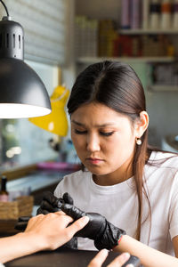 Portrait of young woman looking away