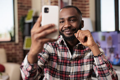 Young man using mobile phone