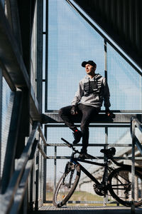 Low angle view of man riding bicycle