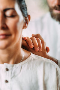 Woman enjoying shiatsu neck and shoulders massage.