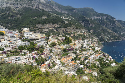 High angle view of townscape by sea