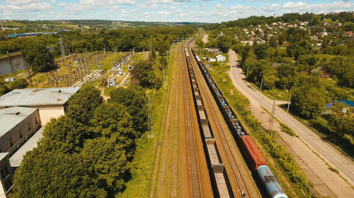 Freight train with cisterns and containers on the railway. aerial view container freight train