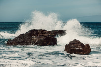 Waves splashing on rocks