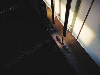 Low section of person on window at home