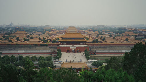 High angle view of buildings in city against clear sky