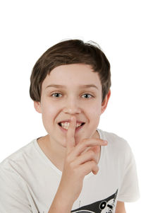 Portrait of boy against white background