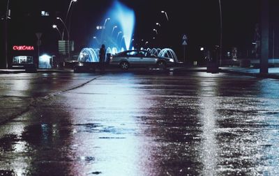 Cars on wet road in rainy season at night