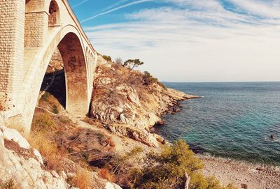 Arch bridge over sea