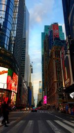 City street and buildings against sky