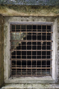 Rusty metal window of old building