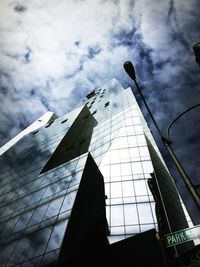 Low angle view of building against cloudy sky