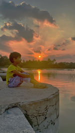 Scenic view of lake against sky during sunset