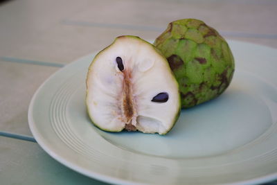 High angle view of fruit in plate on table