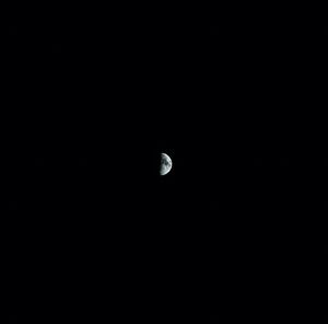 Low angle view of moon in sky at night