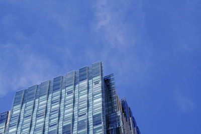 Low angle view of modern building against blue sky tokyo midtown tokyo japan 