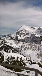 Scenic view of snow covered mountains against sky