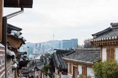 Buildings in city against sky