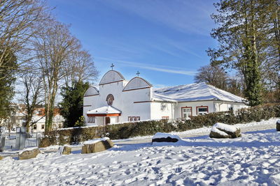 Buildings against sky during winter