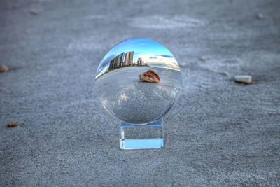 Reflection of crystal ball on glass