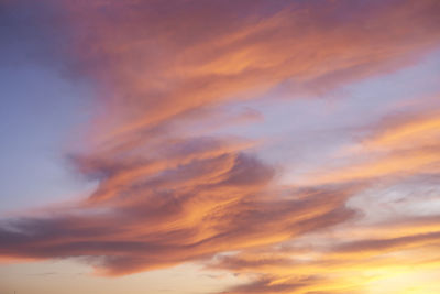 Low angle view of dramatic sky during sunset