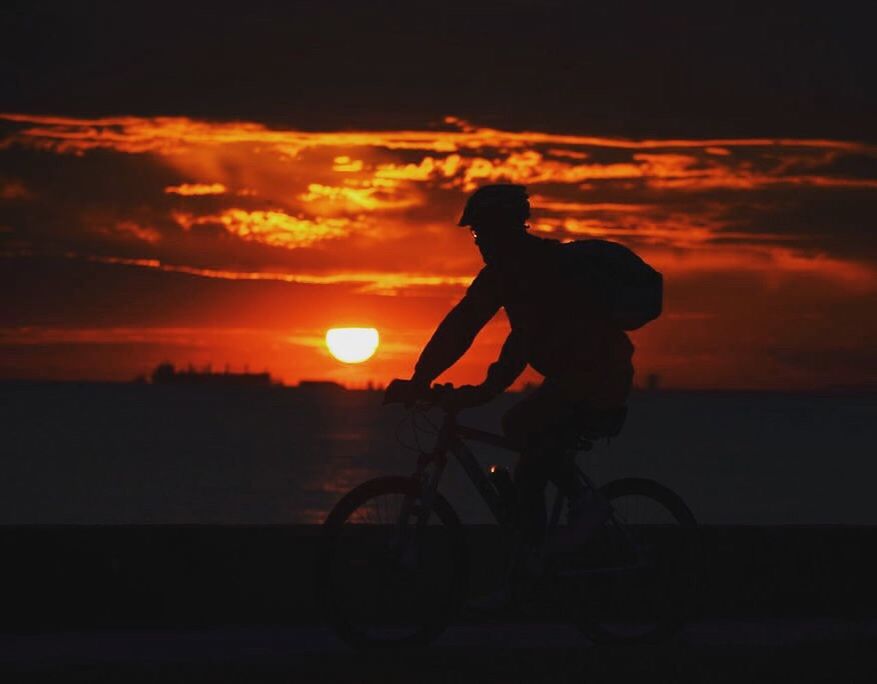 sunset, one man only, bicycle, cycling, only men, one person, silhouette, adults only, riding, transportation, outdoors, headwear, adult, people, men, sport, scenics, biker, nature, sky, sportsman, day