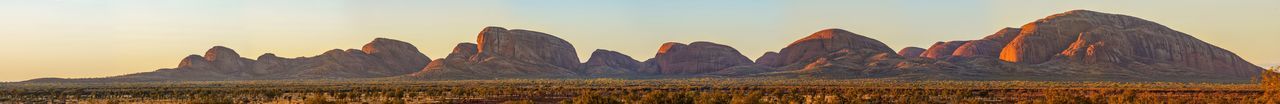 Panoramic view of rock formations against sky during sunset