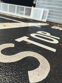 High angle view of road sign on street