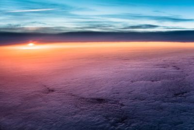 Scenic view of cloudy sky at sunset