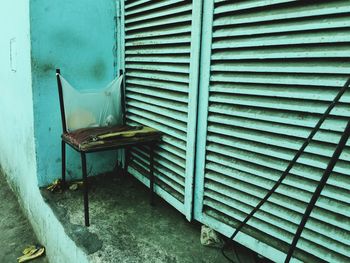 Empty chairs against wall