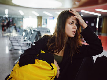 Portrait of woman sitting on seat